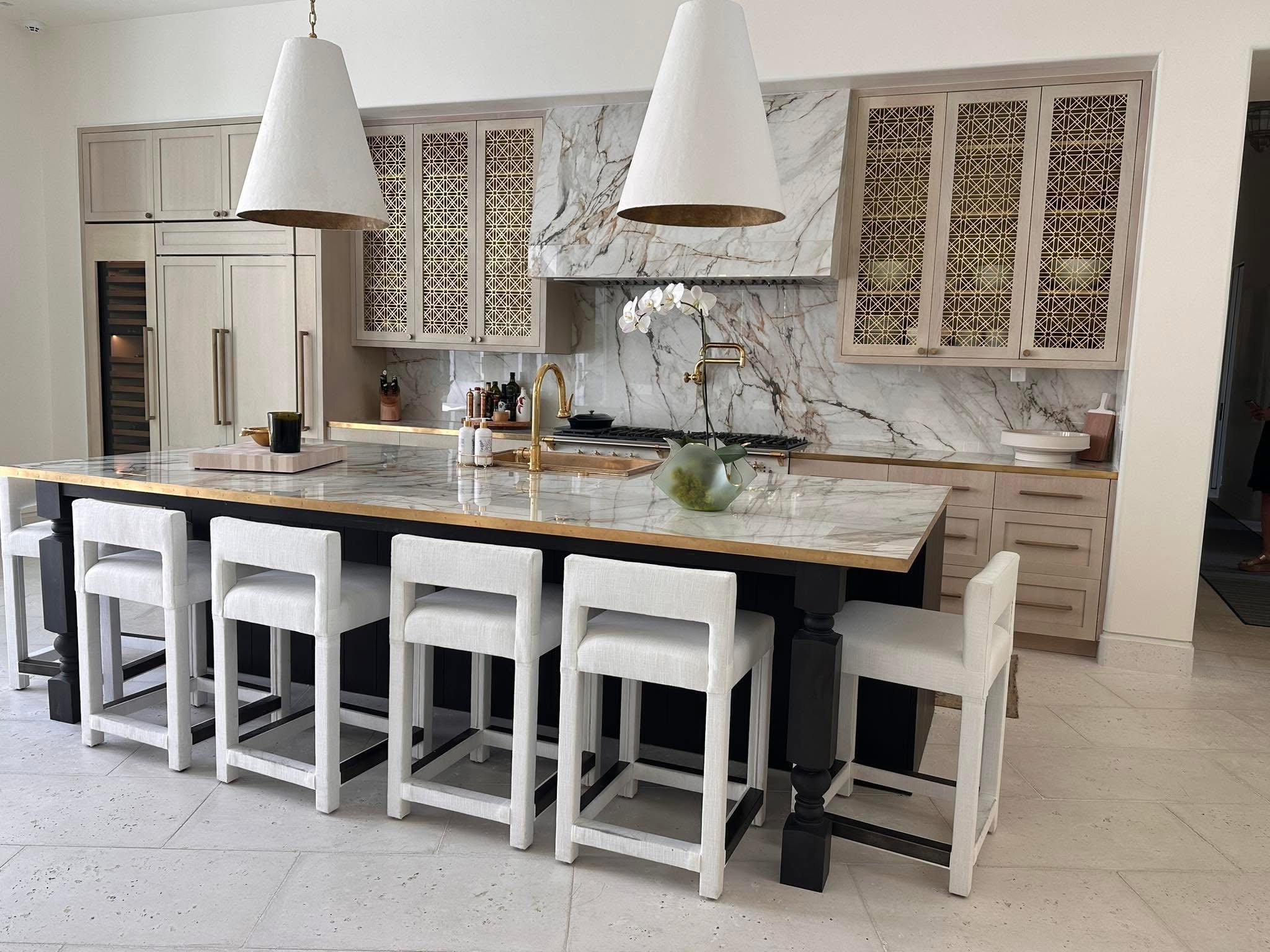 Luxury kitchen with marble backsplash and custom island