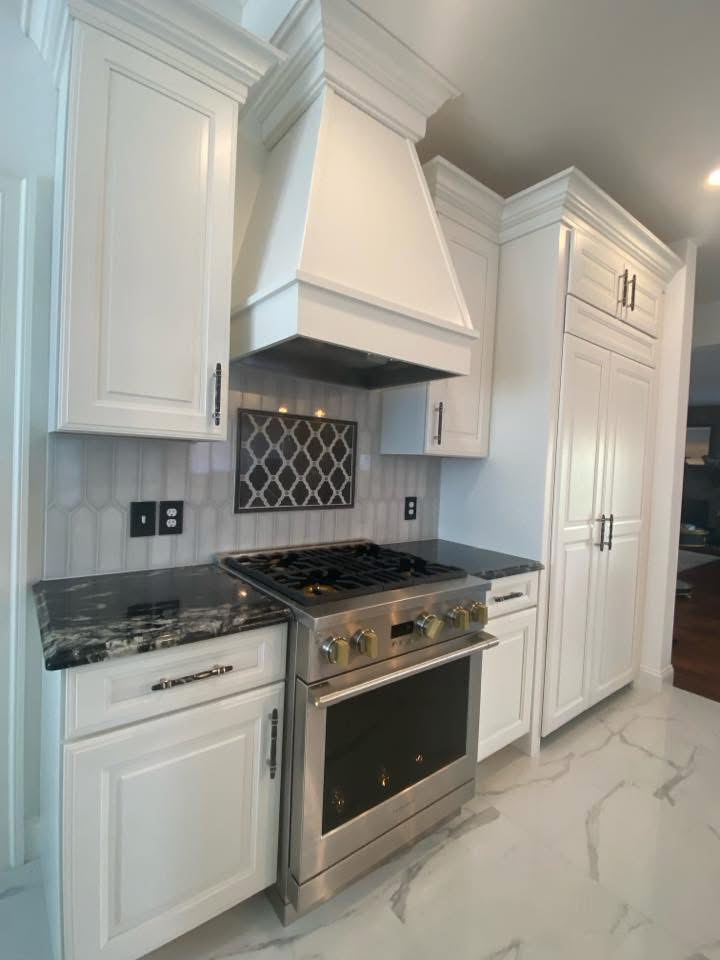 White kitchen with designer backsplash